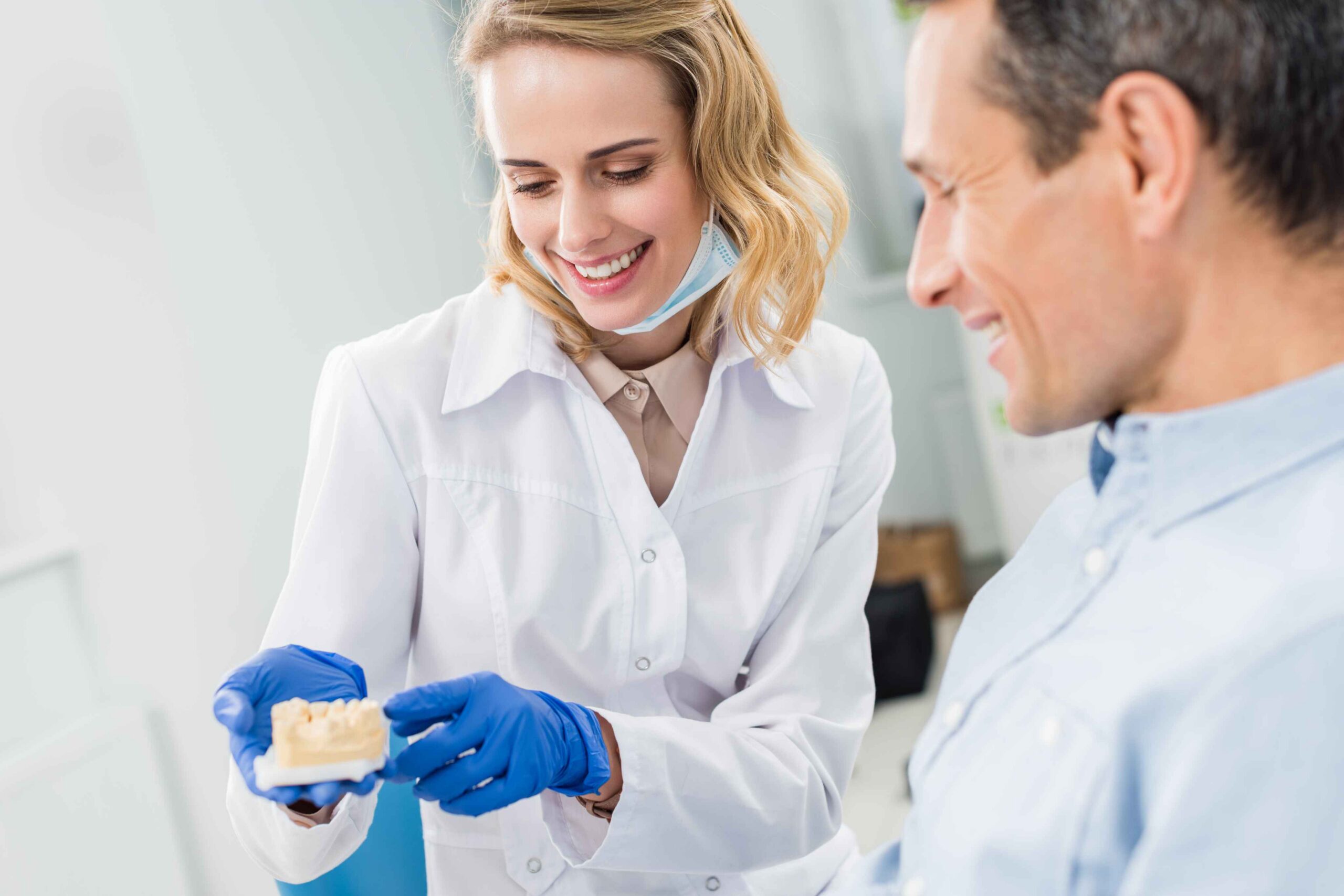 Dentist explaining orthodontic treatment options to a patient.